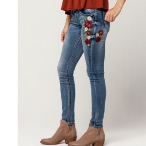 Indigo Skinny Jeans w/ Embroidered Floral Detail